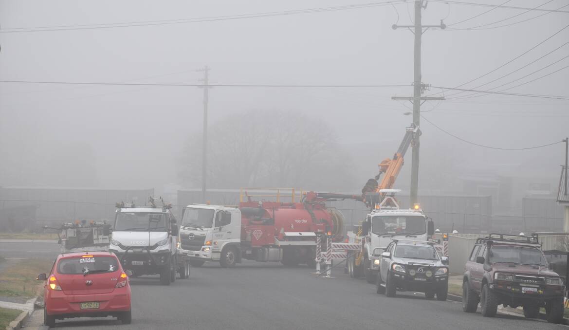 Essential Energy crews worked to fix a widespread outage after a truck hit a power pole at the corner of Sloane and Ottiwell Streets on Monday morning. Picture by Louise Thrower.