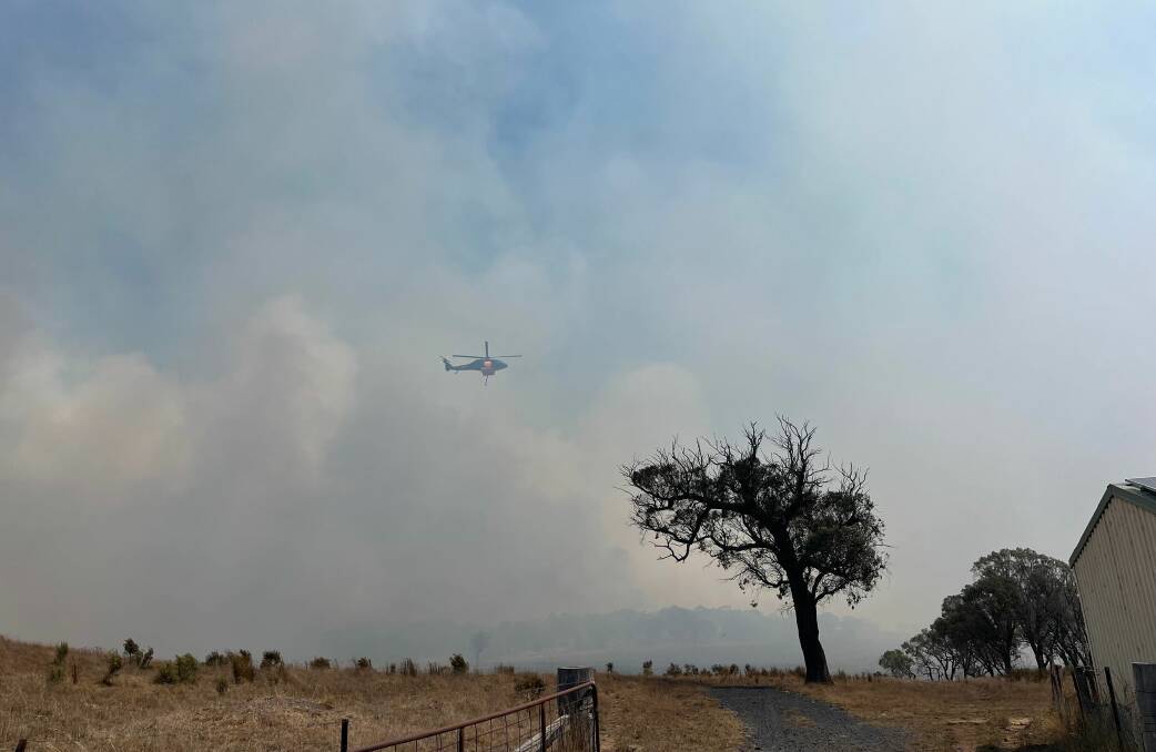An RFS helicopter was enlisted to gather intelligence about a fire that broke out in inaccessible terrain at Bannaby on Saturday afternoon. File photo by Tammi Balfour.