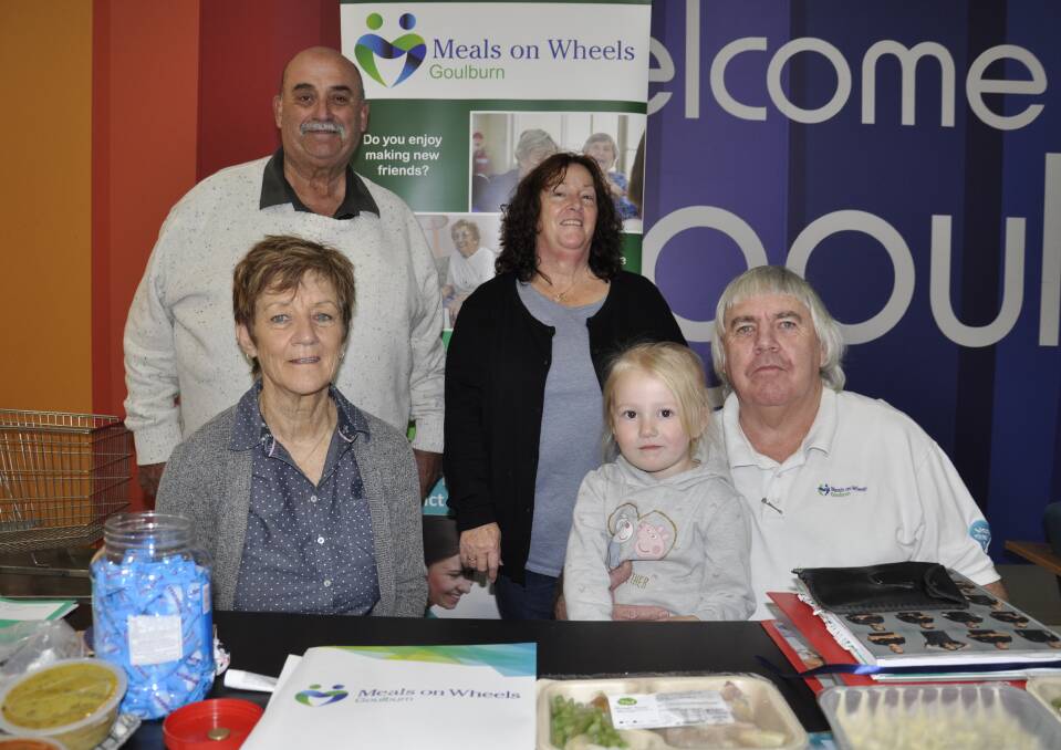 Mayor Peter Walker dropped in at Goulburn Square on Wednesday to help mark National Meals on Wheels Day. He's with volunteer Margaret Croker, Goulburn Meals on Wheels service manager Sharon Grummer, president Michael Parsons, with granddaughter, Mackenzie Marshall. Photo: Louise Thrower.