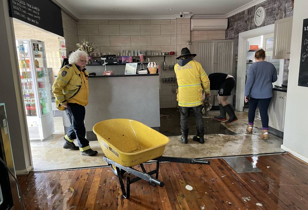 RFS and other volunteers helped clean up business premises in Gunning following Monday's flooding. Picture by RFS.