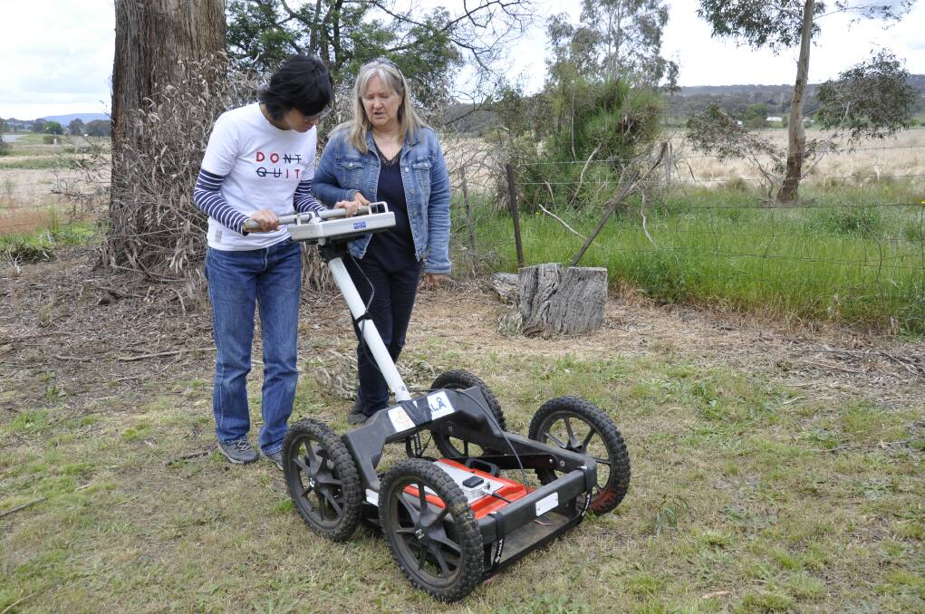 Cold Case co-founder, Louise Steding (right) demonstrates the ground penetrating radar at the Jewish cemetery on Sunday. Picture by Louise Thrower.