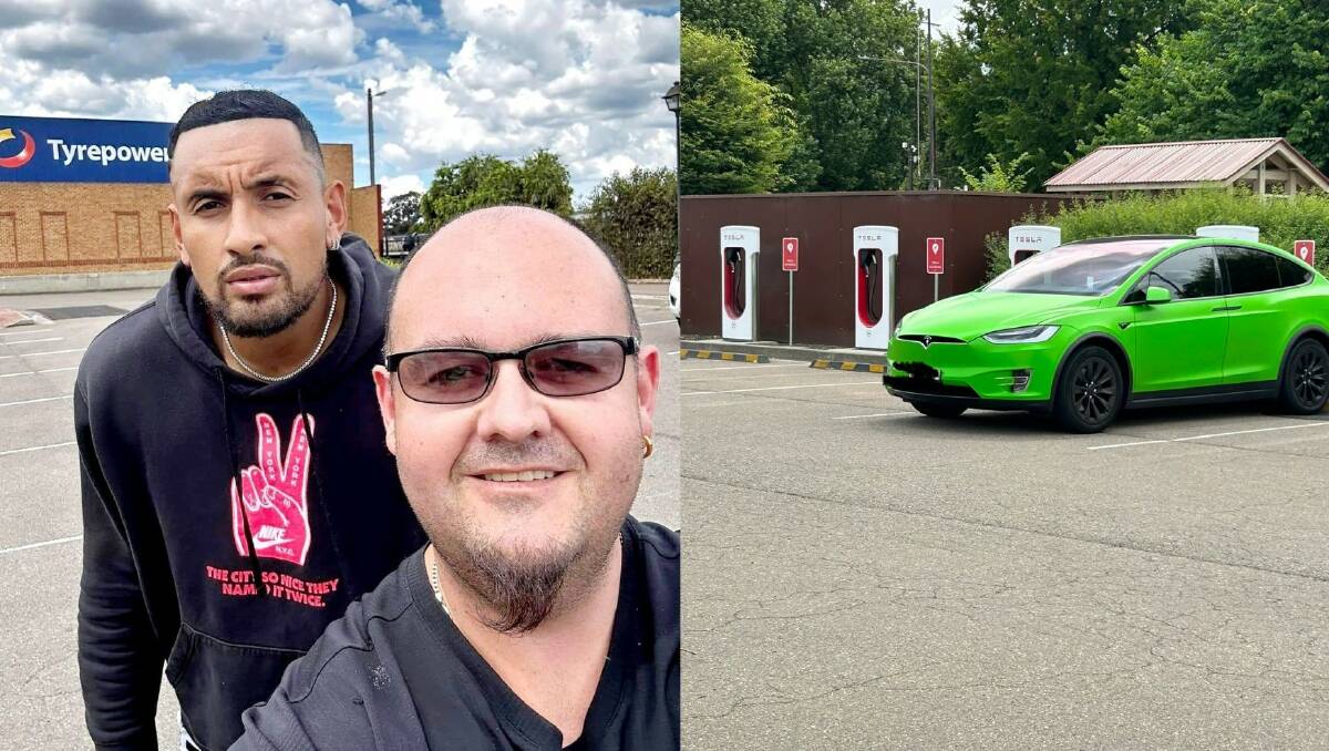 Cr Nathan McDonald snagged a photo with international tennis ace, Nick Kyrgios who was charging his Tesla EV (right) at the Goulburn Visitors Information Centre on Monday. Pictures by Nathan McDonald.