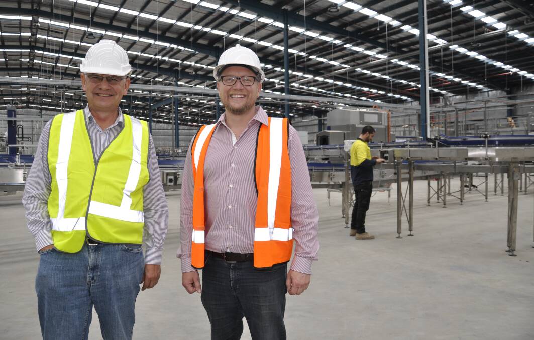 Tribe Breweries community liaison manager and former Goulburn Mulwaree mayor, Geoff Kettle with then operations manager Joerris Noll at the facility in 2018 when the plant was being established. Picture by Louise Thrower.