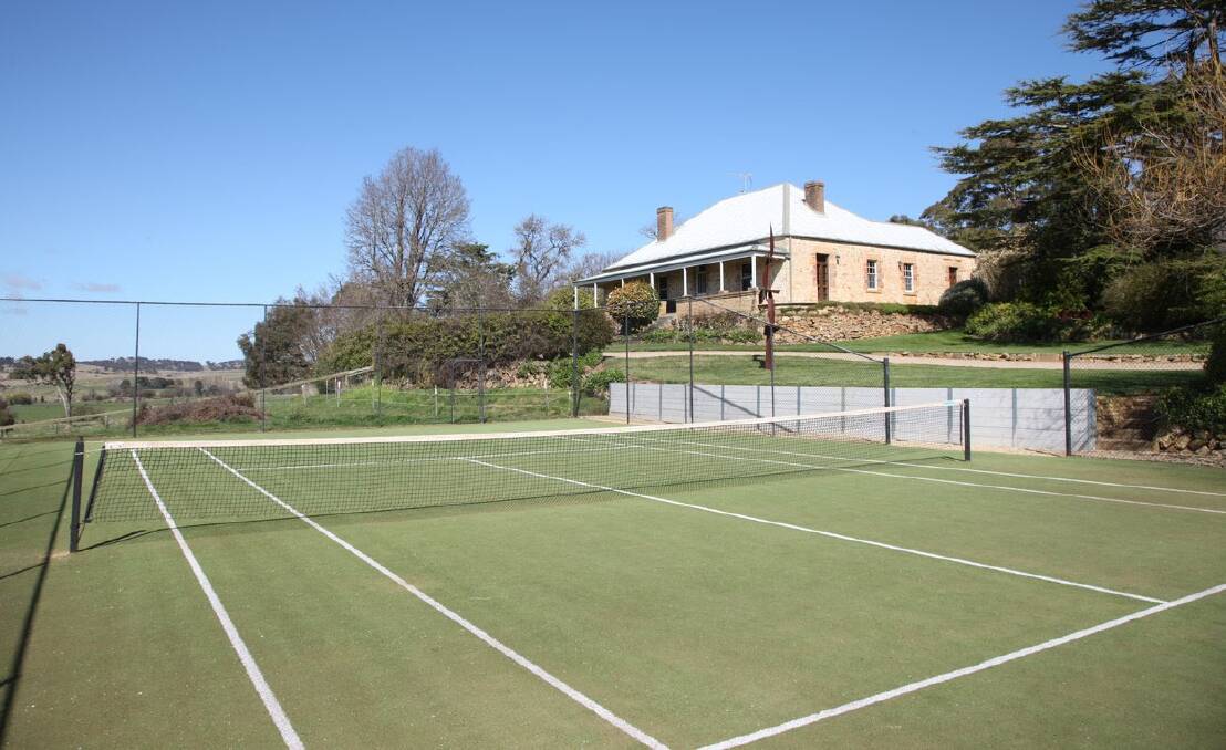 The historic stone homestead, tennis court and English-style gardens are features of the property. Picture supplied.