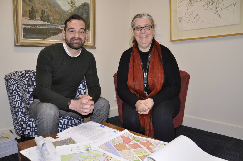 Goulburn Mulwaree Council's senior strategic planner, David Kiernan, and strategic planning business manager, Kate Wooll pore over proposed changes for Goulburn's CBD and surrounds. Picture by Louise Thrower.