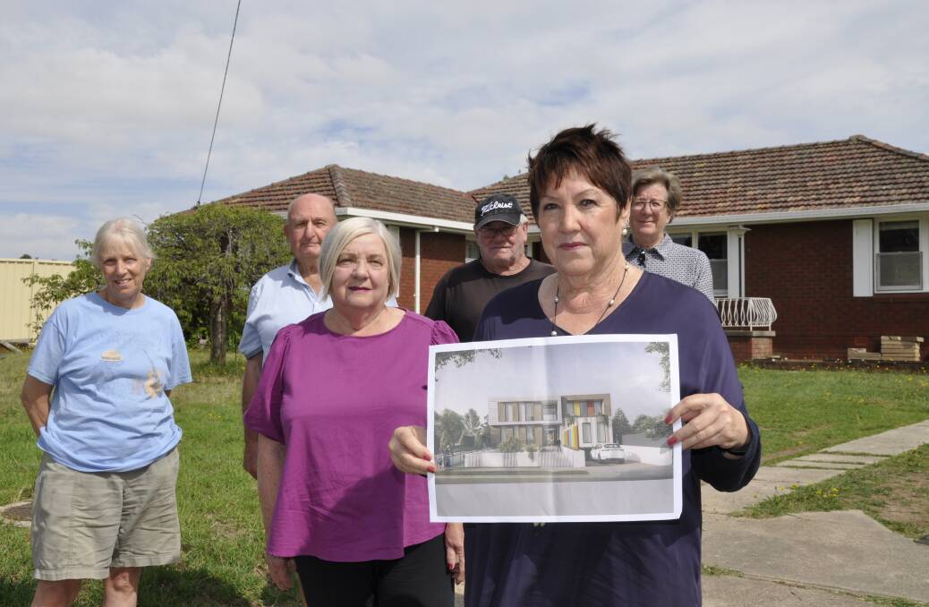 Record Street residents including Catherine McCarthy (front), Faith White (left), Tony and Sue Burgess, Wayne Browne and Julie Archer are opposed to a conditionally approved childcare centre in their street. Picture by Louise Thrower.