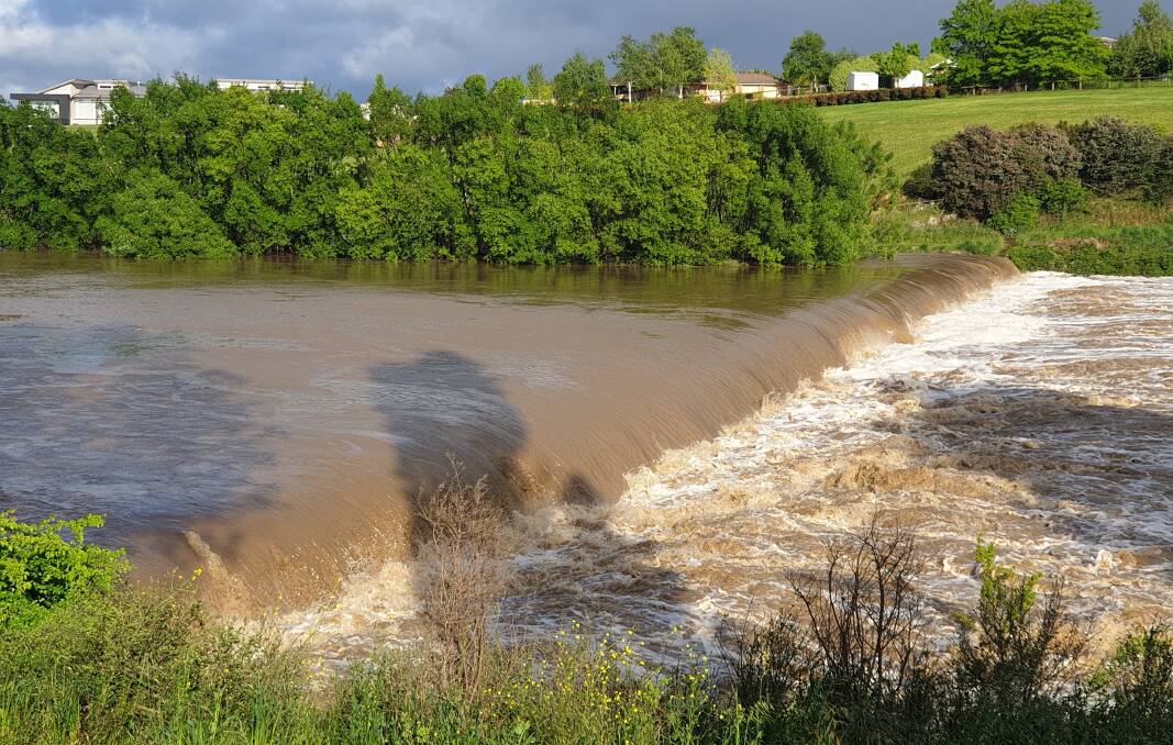 Water from further up the Wollondilly River was rushing over Marsden Weir in Goulburn on Tuesday morning. Picture by Jacob McMaster.