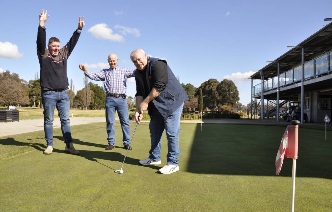 Rotary Club of Goulburn president, Steve Ruddell, practises his shots, watched by animated members, Wal Lawson and Geoff Thrower. Picture by Louise Thrower.