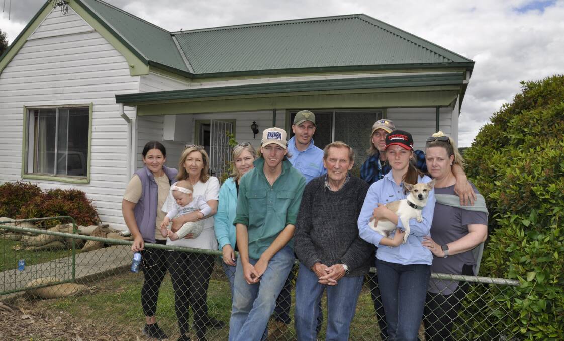 Dennis and Karen Waters, with daughter Breea, son Jake (front) and extended family outside their Warrataw Street home that was flooded on Monday, October 31. The house and a rear 'granny' unit have not been occupied since. Picture by Louise Thrower. 