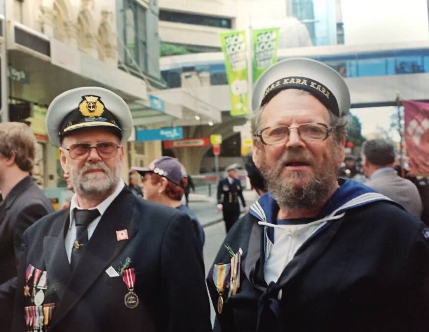 John Walker (right) with his former marine engineer brother, Frank, marching in a Sydney Anzac parade. John was wearing his grandfather, Allen's, uniform. Picture supplied.
