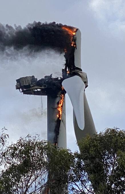 Smoke from the fire in the 80-metre high turbine was visible from the nearby Hume Highway. Picture by Matt Curvey.