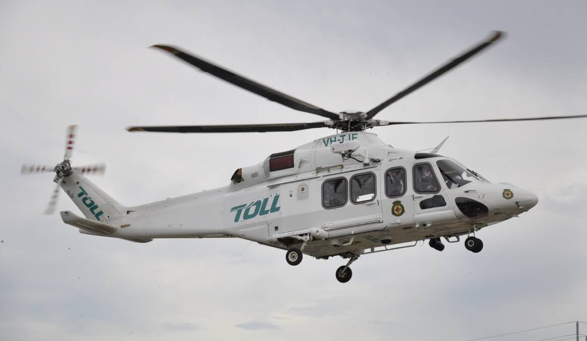 The Toll helicopter is on the scene of crash near Tarago. File picture by Louise Thrower.