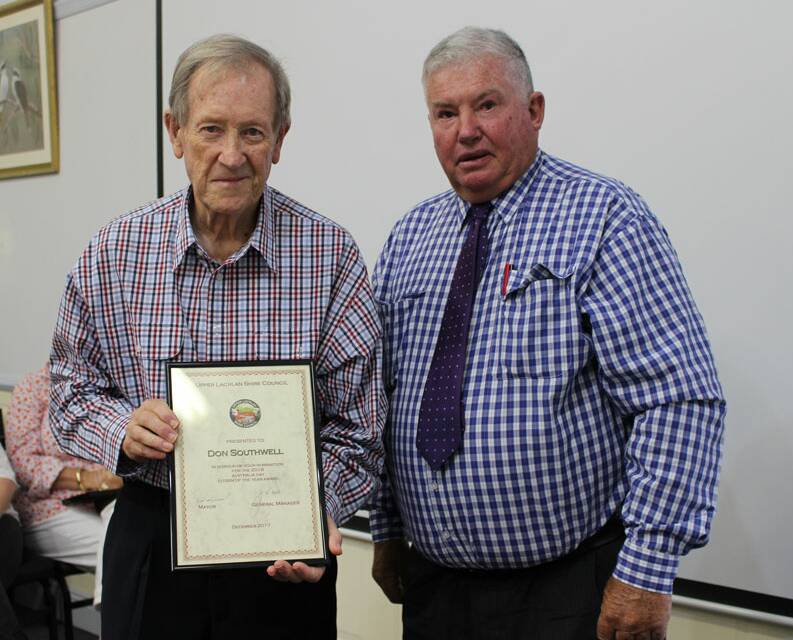 Former Upper Lachlan Shire Mayor, Brian McCormack, presented Don Southwell with his Australia Day citizen of the year nomination in 2018. Picture supplied.