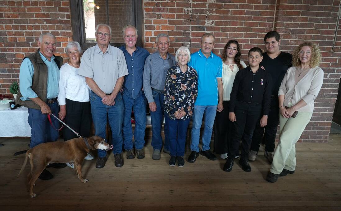 The Urban Monks, a local group that participated in the CRISP program welcomed and supported the Alkhusis, a Syrian refugee family, during their first year in Australia. From left: Robert Favaloro, Gail Favaloro, Dennis Durbidge, Darryl Patterson, John and Jan Weatherstone, Mazin Alkhusi, Rouba Alkhusi, Elyas Alkhusi, George Alkhusi and Maggie Patterson. Picture supplied.