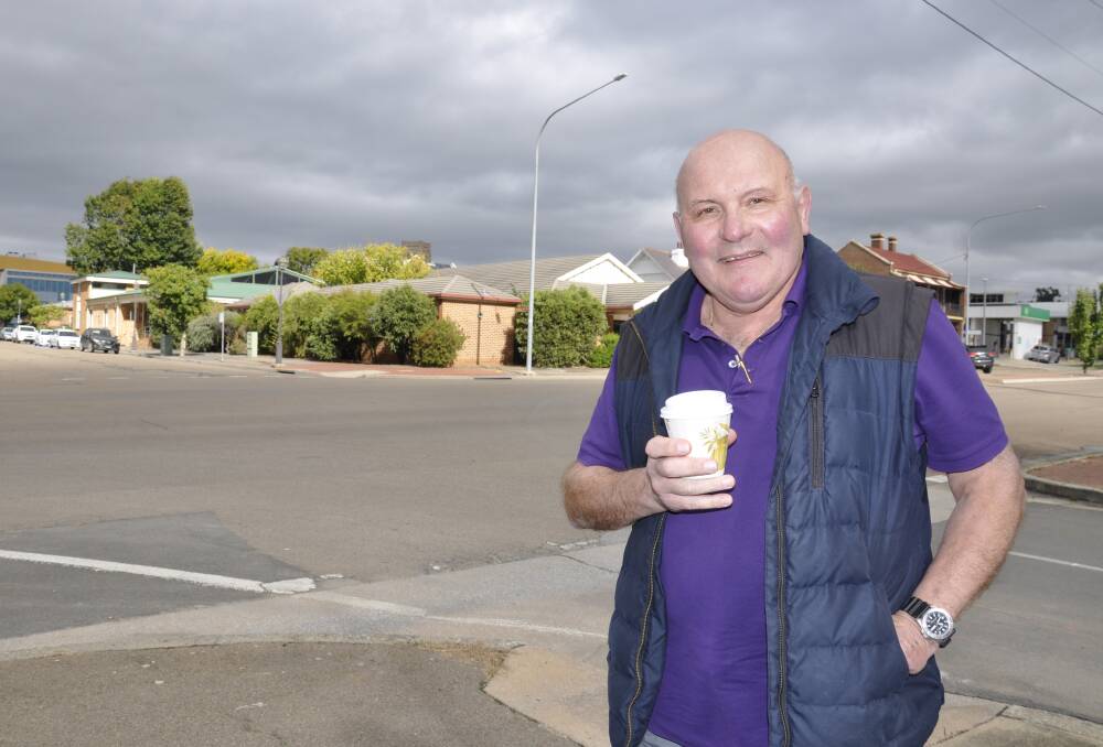 MOVING ON: Michael Prevedello is looking forward to a more relaxed lifestyle following his retirement as news editor at radio station 2GN. Behind him is the site of the station's first premises in McKell Place. Photo: Louise Thrower.