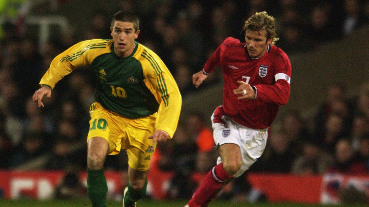 Harry Kewell charges past David Beckham during Australia's 2003 victory over England. The Matildas will have the chance to emulate the Socceroos on Wednesday night. Picture Getty Images