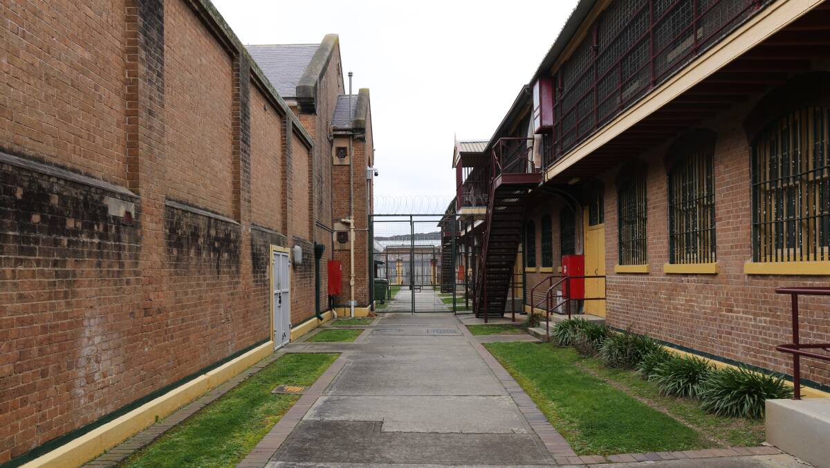A walkway towards cell block yards that have outdoor showers at Goulburn Correctional Centre. 