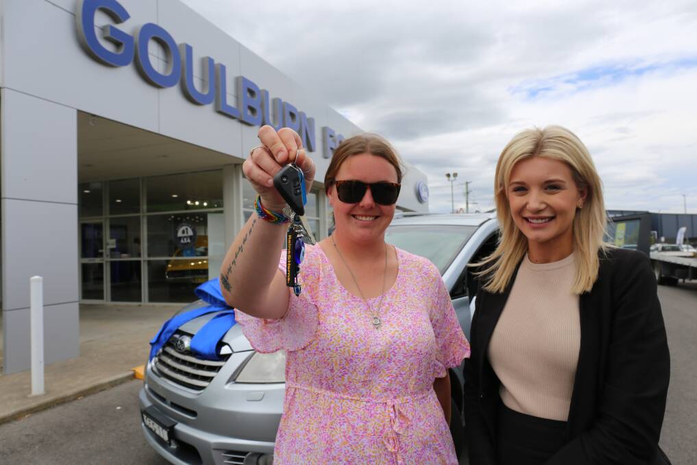 Kyarnna Plumb handed off the keys to the freshly polished Subaru Tribeca to Leasha Maree, whose Ford Territory stolen and destroyed just days earlier. Pictures by Jacob McMaster.