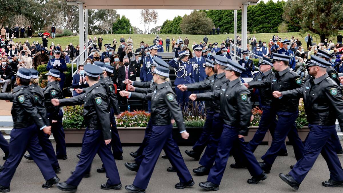 Police recruits march out during a recent graduation ceremony, with 145 new officers graduating from class 355 on October 14. 