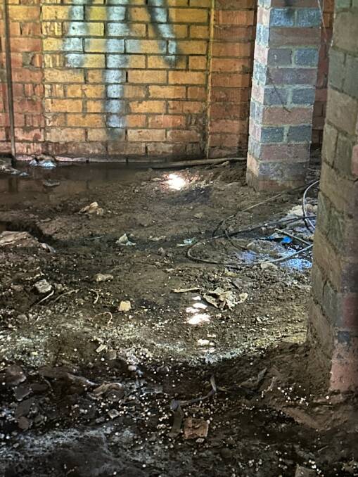 Underneath Stacey Whitton's home in Spring Street after it was discovered a sewer pipe had broken. Picture supplied 