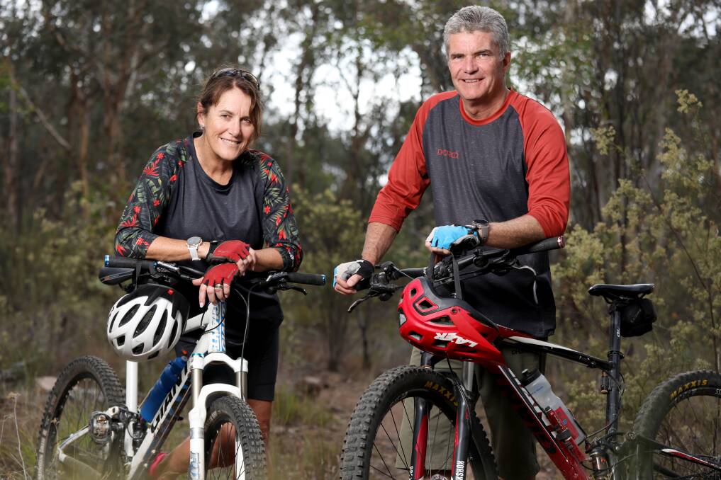 Steve Whan and his wife Cherie during a bike ride behind Karabar on Sunday. Picture by James Croucher