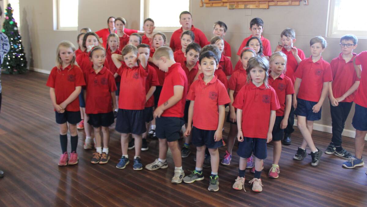 CAROLLING: Children from Taralga Public School children dropped in to the senior's event to entertain the crowd with song.