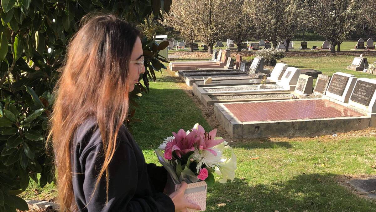 friend visits friend's grave