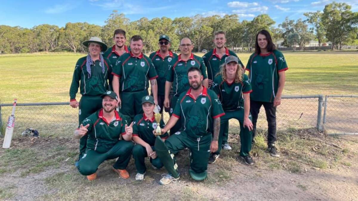 Winners: The Marulan Madbulls, exhausted but thrilled, pose with their hard-earned silverware. Photo: Marulan Cricket Club. 