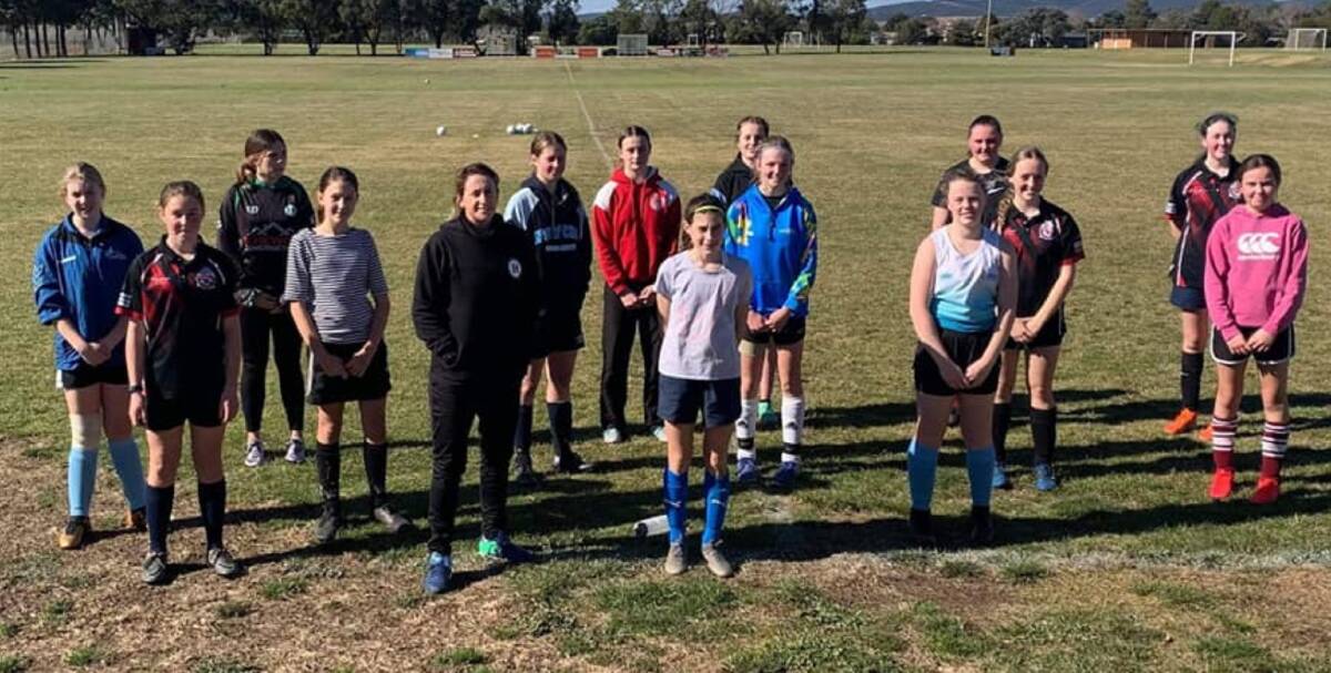 Beginnings: The coaching clinic run by former Matilda, Heather Garriock (front, wearing all black) in Goulburn last July kick-started the effort to further fund regional soccer in NSW. Photo: STFA. 