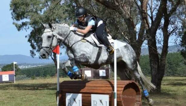 Up and over: Lucy O'Sullivan and Jackson during the competition in Canberra, which ran from March 6 to March 7. Photo: Supplied.