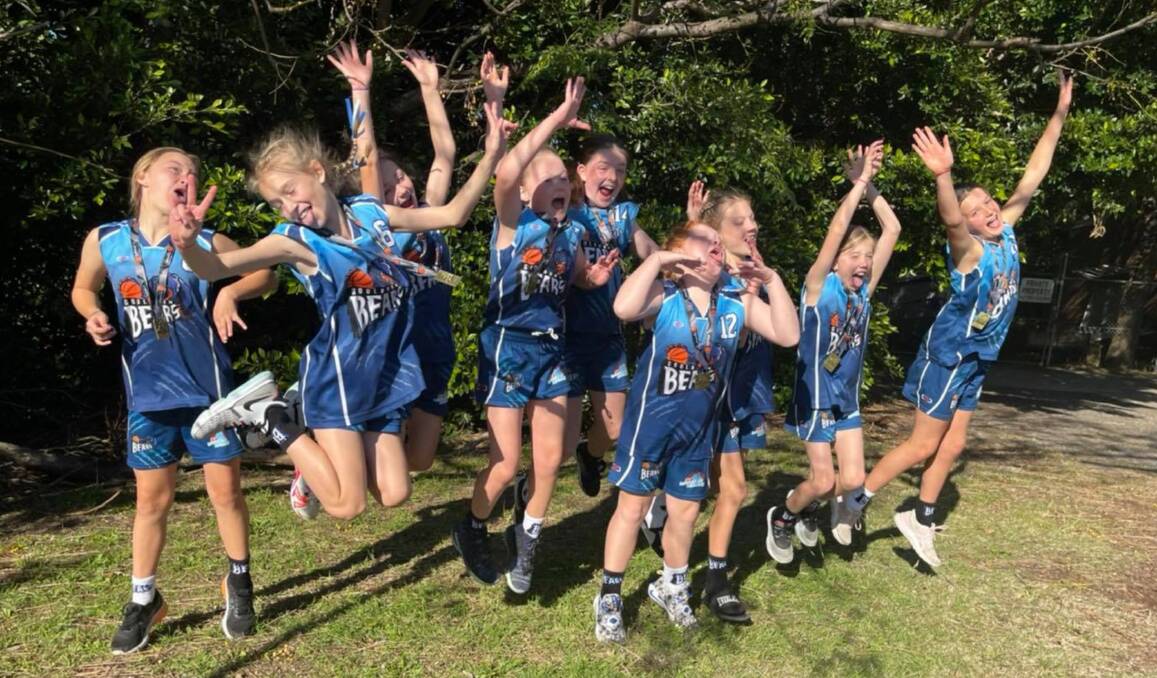 Jump for joy: The Goulburn Under 12s Girls side is ecstatic following a narrow five-point grand final victory. Photo: Goulburn Bears. 