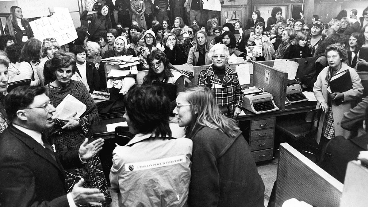 Then-acting editor John Farquharson speaks with a group of women occupying The Canberra Times' offices in 1975. Picture file