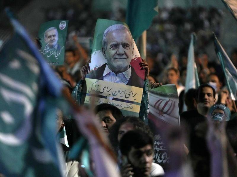 Reformist Masoud Pezeshkian is facing off against hardliner Saeed Jalili in Iran's run-off election. (AP PHOTO)