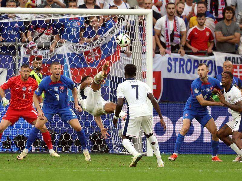 Jude Bellingham (centre) rescues England with a spectacular overhead equaliser against Slovakia. (EPA PHOTO)