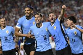 A goal by Uruguay's Mathias Olivera (No.16, centre) spelt doom for the United States in Kansas City. (AP PHOTO)