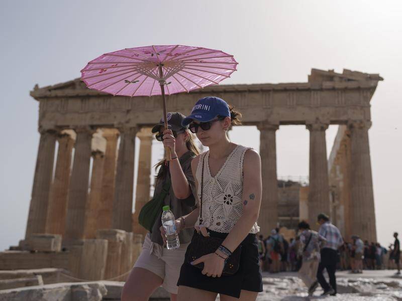 A heatwave has pushed temperatures to 39C in Athens and even higher in parts of central Greece. (AP PHOTO)