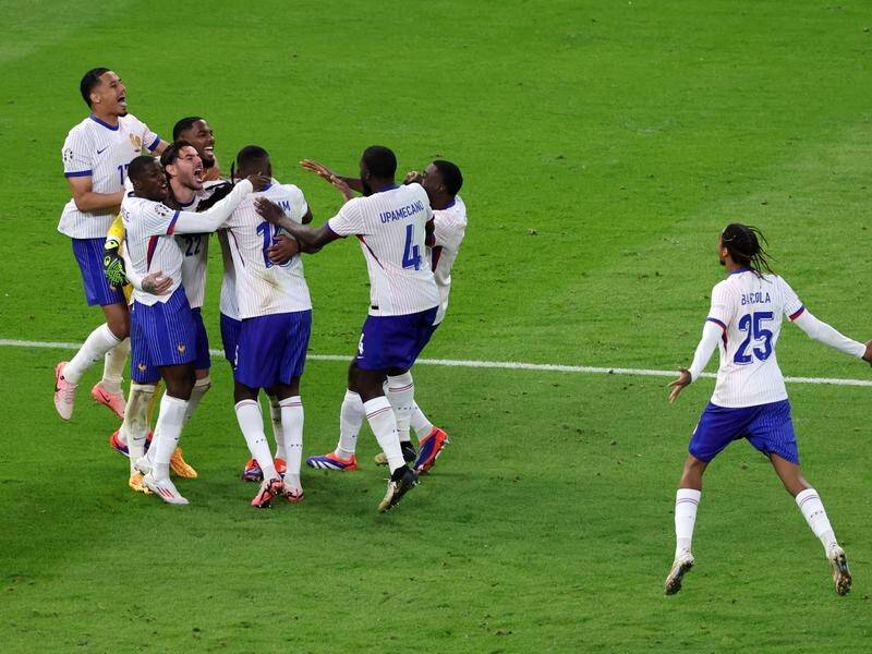 France celebrate after winning their Euro Championship quarterfinal shootout 5-3 against Portugal. (EPA PHOTO)