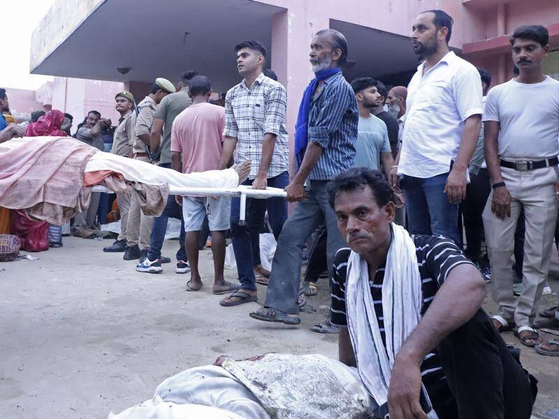Police say at least 60 people have died in a crush in northern India. (AP PHOTO)