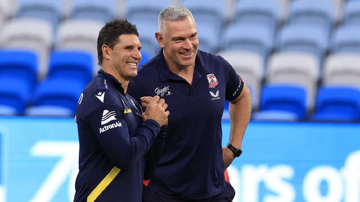 Trent Barrett (L) and Jason Ryles (R) share a laugh during their roles as assistant coaches in 2023. (Mark Evans/AAP PHOTOS)