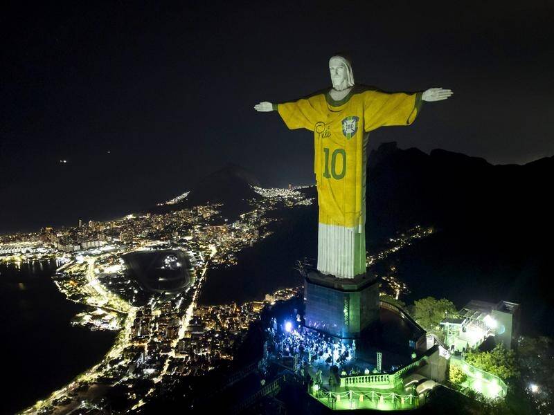 Rio de Janeiro's Christ the Redeemer statue illuminates the first anniversary of Pele's death. (AP PHOTO)