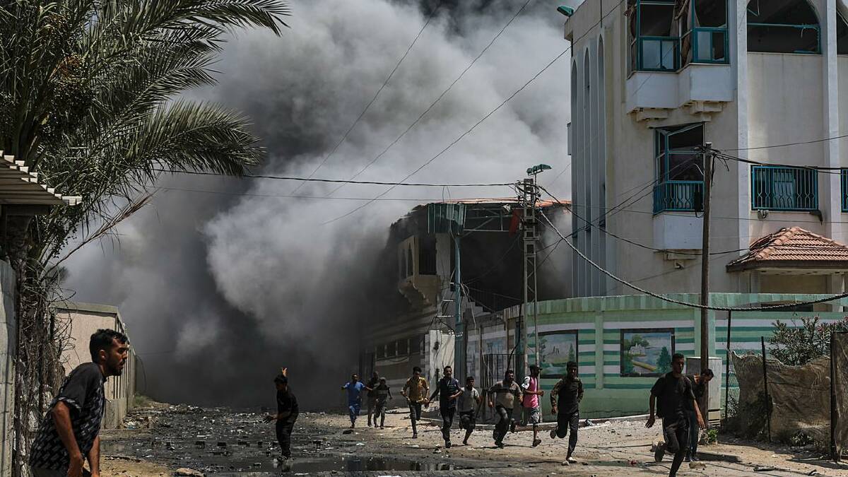 Displaced Gazans were told to flee to al-Bureij after Deir al-Balah came under fire. (EPA PHOTO)