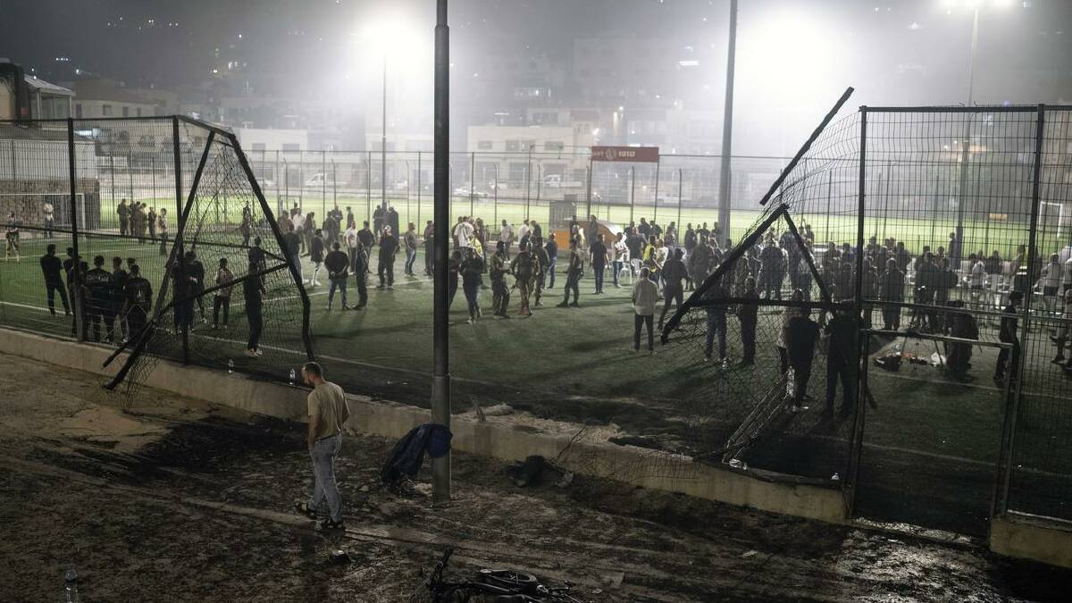 Lebanon's Hezbollah has denied accusations it fired the missile, which hit a sports field. (AP PHOTO)