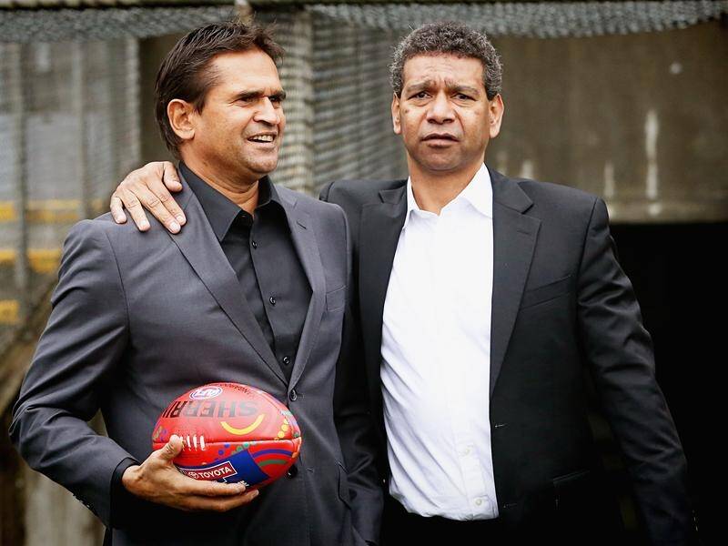 Collingwood have apologised to former Saints Nicky Winmar (L) and Gilbert McAdam over racist abuse. (Hamish Blair/AAP PHOTOS)