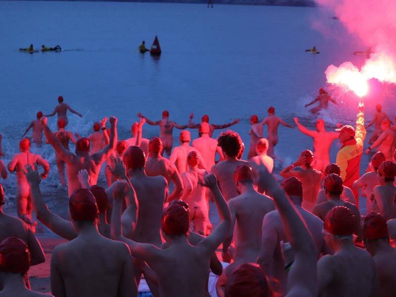 Capacity will be increased for the nude solstice swim at Dark Mofo after record numbers in 2023. (Ethan James/AAP PHOTOS)