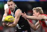 St Kilda's Callum Wilkie felt the pressure from Sydney's Isaac Heeney, who could face scrutiny. (Joel Carrett/AAP PHOTOS)