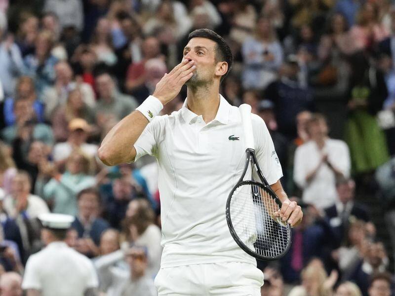 Novak Djokovic salutes the Centre Court after ending Alexei Popyrin's fine challenge at Wimbledon. (AP PHOTO)