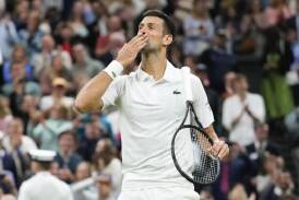 Novak Djokovic salutes the Centre Court after ending Alexei Popyrin's fine challenge at Wimbledon. (AP PHOTO)