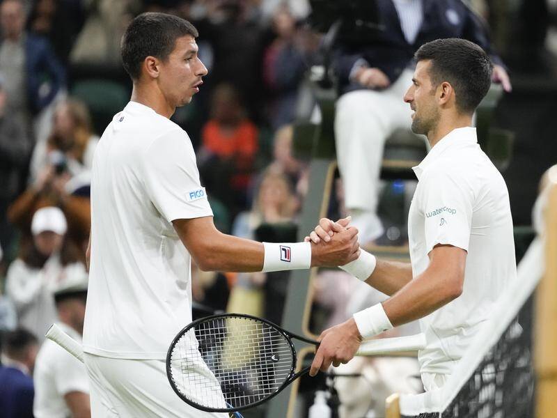 Alexei Popyrin congratulates Novak Djokovic on his win at Wimbledon. (AP PHOTO)