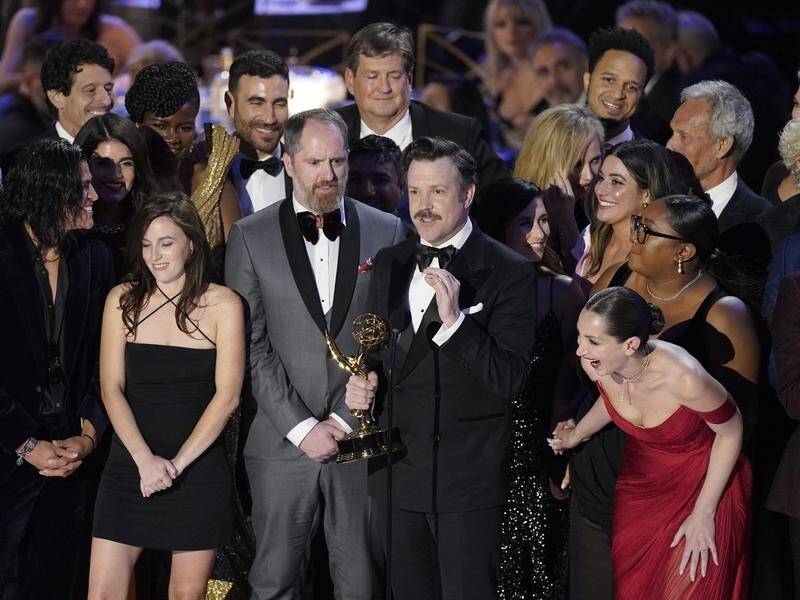 The cast of Ted Lasso with the 2022 Emmy Award for outstanding comedy series. (AP PHOTO)