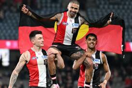 Bradley Hill was chaired off after his 250th game resulted in a big win for St Kilda. Photo: Daniel Pockett/AAP PHOTOS